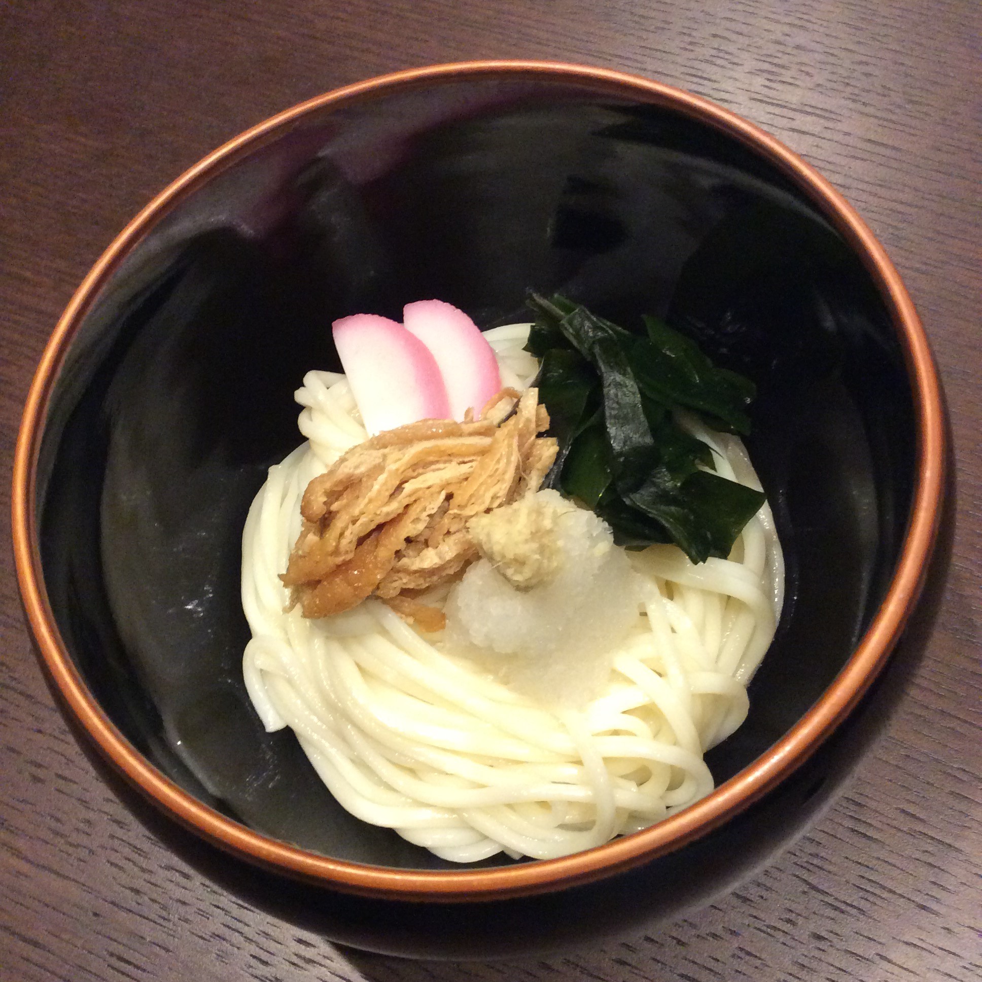 Cold Udon Noodles Topped with a  Chilled Sauce and Other Ingredients