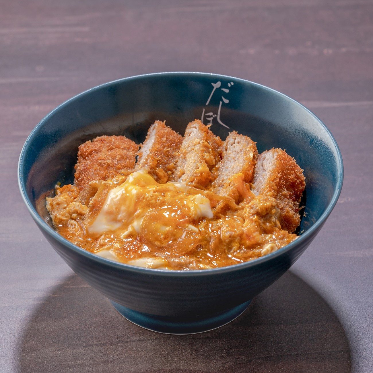 Donburi Bowl of Rice Topped with Pork Cutlet, Eggs, and Onions