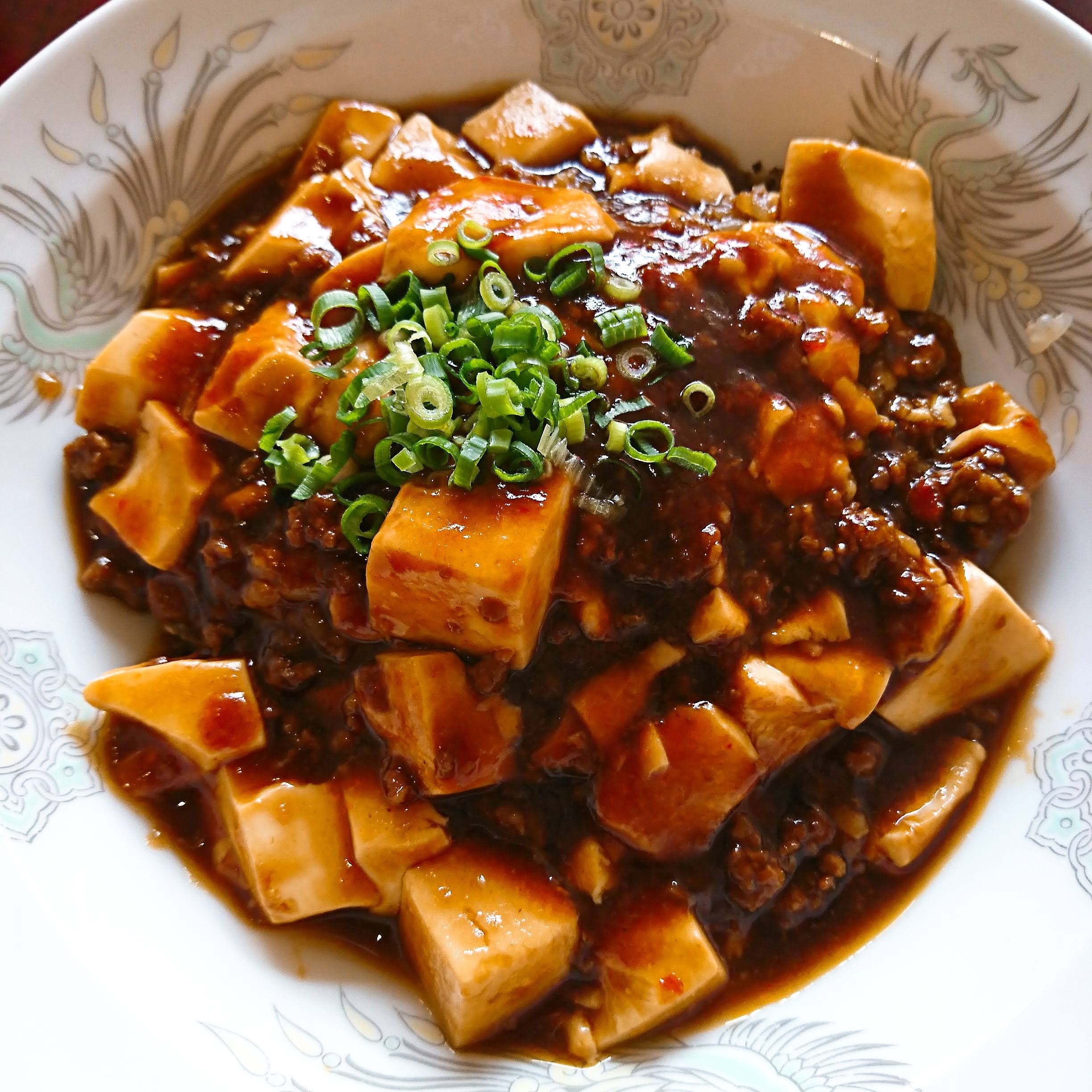 Donburi Bowl of Rice Topped with Meat-and-chili Sauce